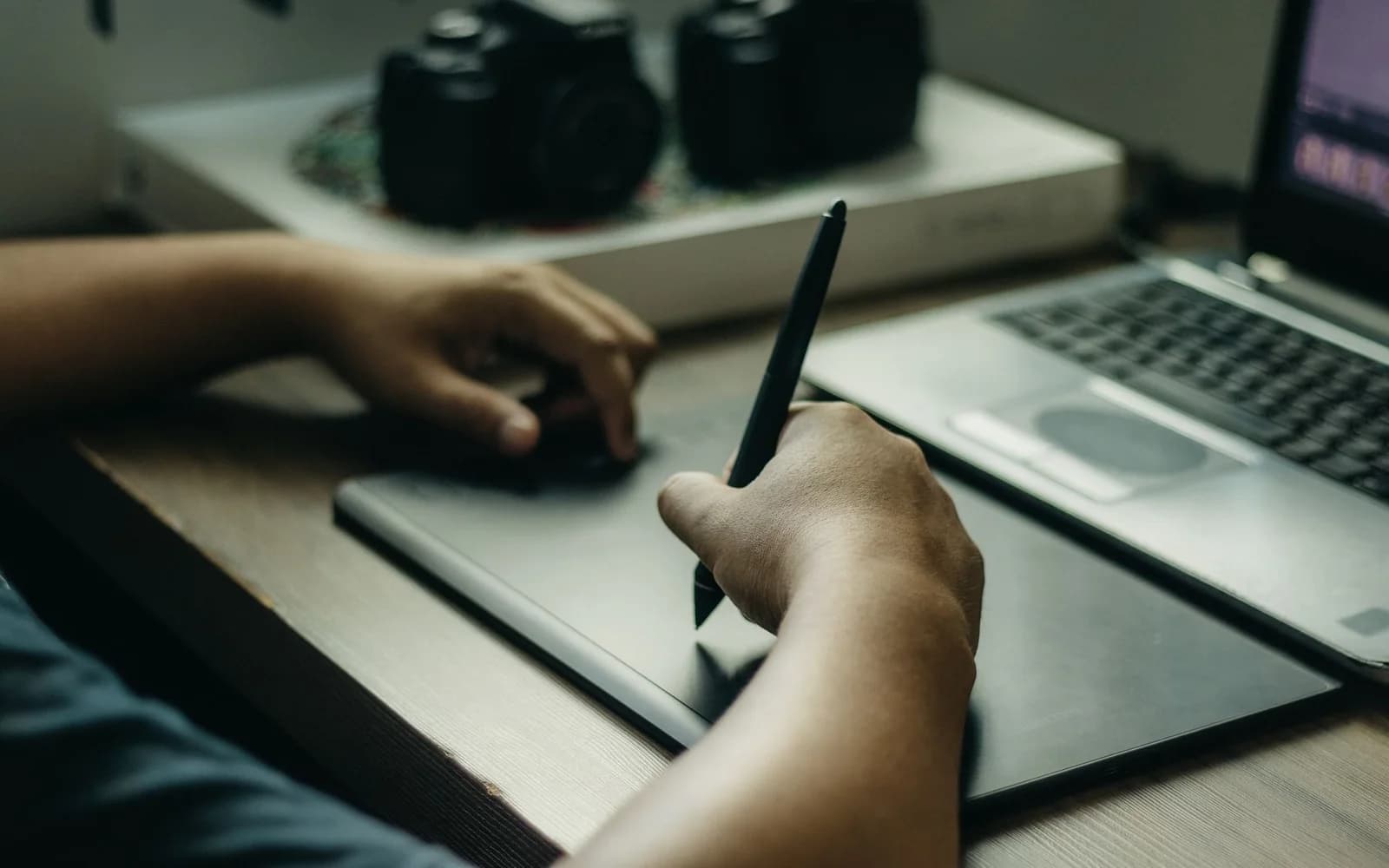 Designers reviewing paper wireframes at a desk