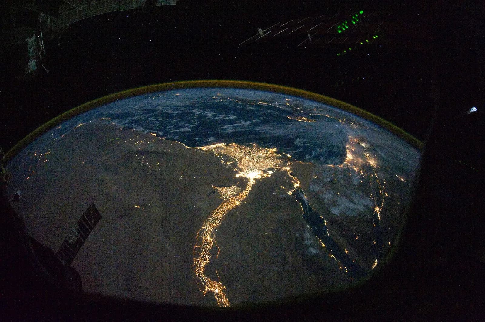 Egypt at night from the International Space Station: the lit Nile Valley runs up to the bright glow of Cairo and the fan of the Nile Delta on the Mediterranean, with the Sinai Peninsula and the Red Sea to the right