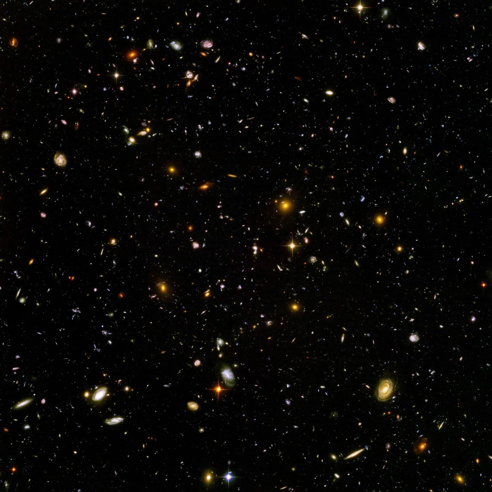 The Hubble Ultra Deep Field: thousands of galaxies of many shapes and colours scattered across black space